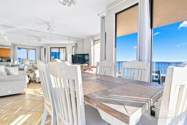 dining area featuring ceiling fan and light tile patterned flooring