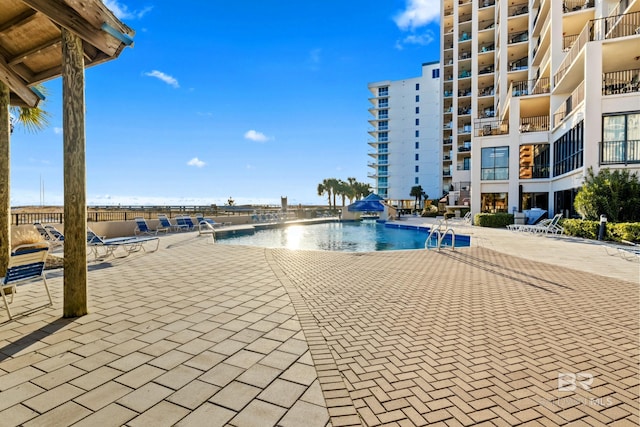 view of swimming pool featuring a patio