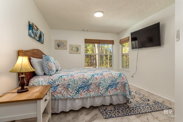 bedroom with a textured ceiling