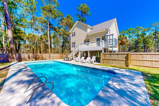 view of swimming pool featuring a wooden deck