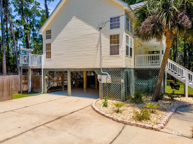 view of side of property featuring a carport