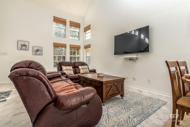 living room with a towering ceiling