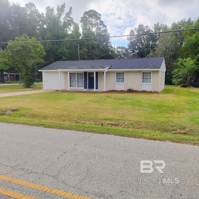 ranch-style home with a front yard