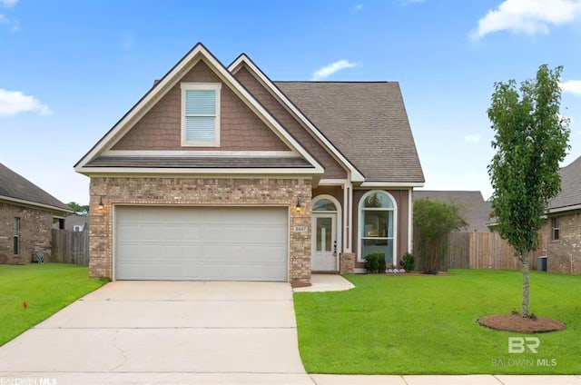 view of front facade featuring driveway, a garage, fence, a front lawn, and brick siding