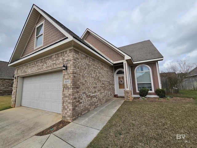 view of front of property featuring a garage, a front lawn, concrete driveway, and brick siding