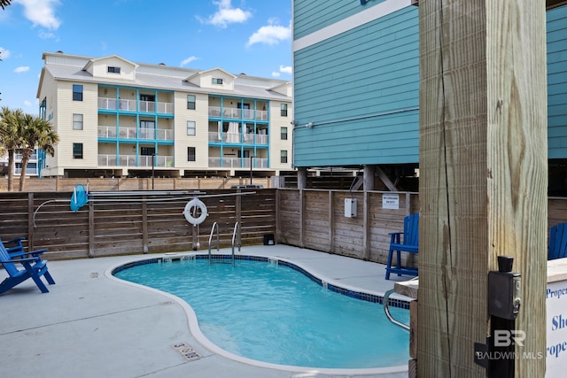 view of pool featuring a patio