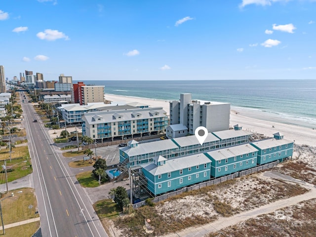 aerial view with a water view and a view of the beach