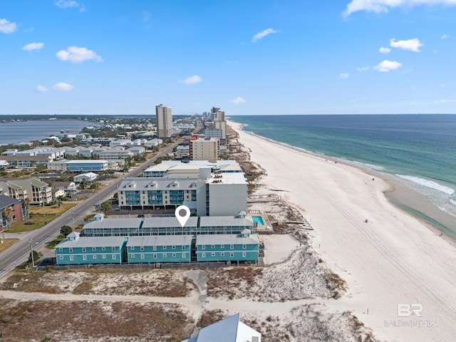 bird's eye view featuring a beach view and a water view