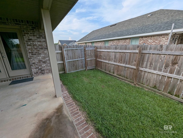 view of yard featuring a fenced backyard and a patio