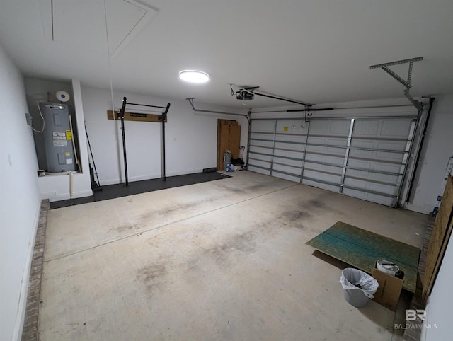 garage featuring a garage door opener and water heater