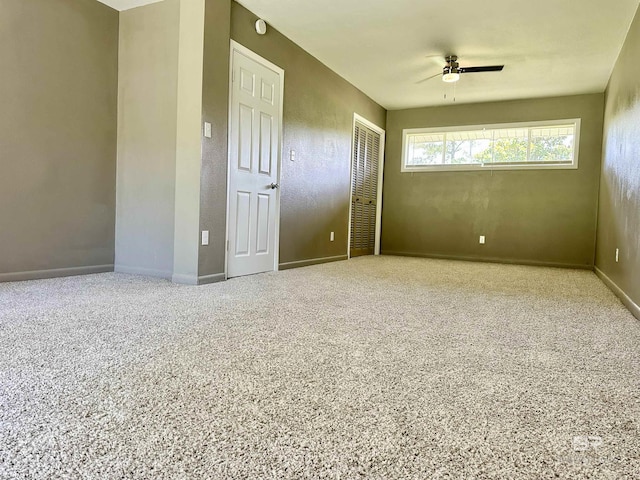 spare room with ceiling fan