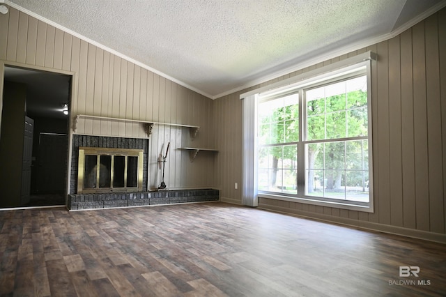 unfurnished living room featuring dark hardwood / wood-style flooring, a fireplace, a wealth of natural light, and vaulted ceiling