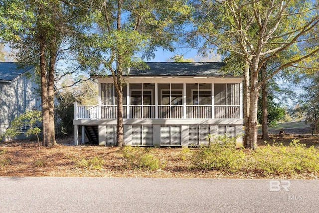 view of front of house with a sunroom