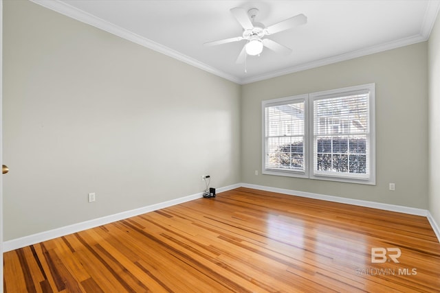 empty room with hardwood / wood-style flooring, ceiling fan, and crown molding