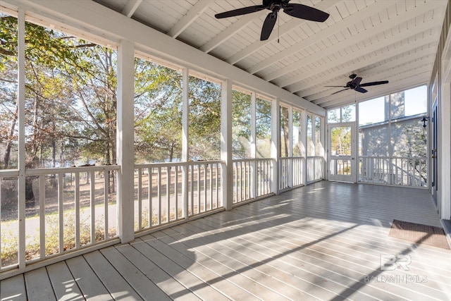 unfurnished sunroom featuring ceiling fan and a healthy amount of sunlight