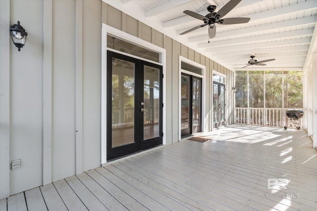 wooden terrace with ceiling fan, a grill, and french doors