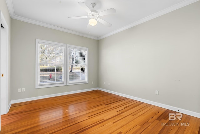 unfurnished room featuring wood-type flooring, ceiling fan, and crown molding