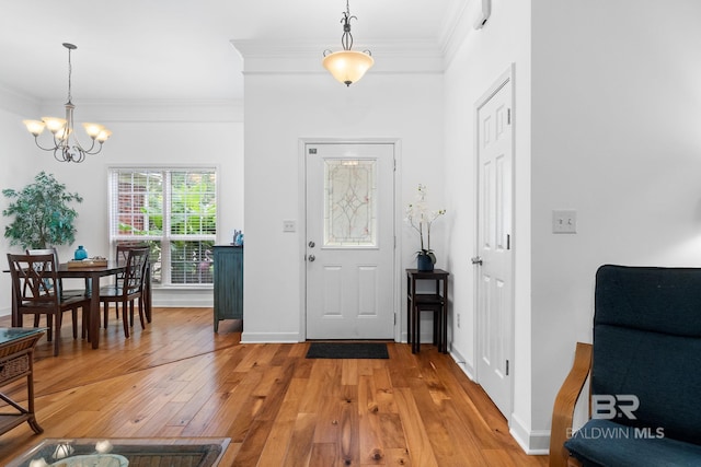 22091 Pecan Loop, Silverhill, AL 36576 - foyer featuring a chandelier, light wood-type flooring, and crown molding