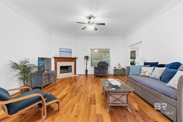 22091 Pecan Loop, Silverhill, AL 36576 - living room featuring ornamental molding, a ceiling fan, light wood-style floors, and a premium fireplace