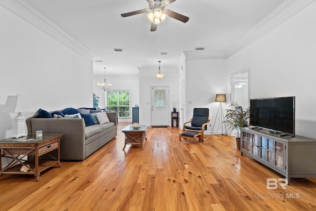 22091 Pecan Loop, Silverhill, AL 36576 - living room featuring ornamental molding, ceiling fan, light wood-type flooring, and a chandelier