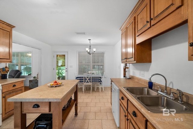 22091 Pecan Loop, Silverhill, AL 36576 - kitchen with dishwasher, a chandelier, open shelves, and brown cabinetry