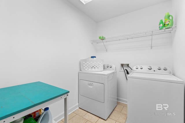 22091 Pecan Loop, Silverhill, AL 36576 - laundry room with washing machine and dryer and light tile patterned flooring