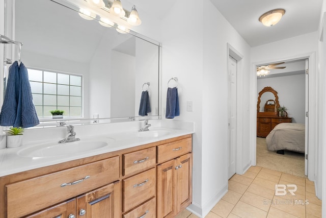 22091 Pecan Loop, Silverhill, AL 36576 - full bathroom with double vanity, tile patterned floors, ensuite bathroom, and a ceiling fan