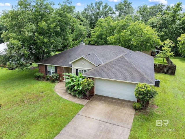 22091 Pecan Loop, Silverhill, AL 36576 - view of front of home with brick siding, a shingled roof, a front yard, and concrete driveway