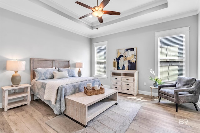 23901 Cypress Xing, Orange Beach, AL 36561 - bedroom featuring a tray ceiling, light wood-style floors, and crown molding