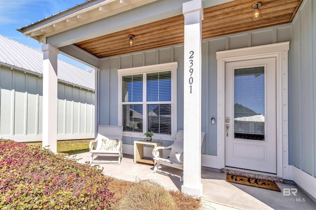 23901 Cypress Xing, Orange Beach, AL 36561 - property entrance with covered porch and board and batten siding