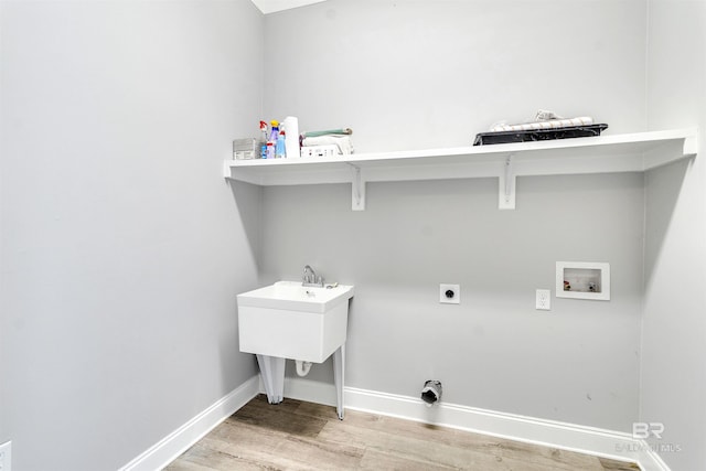 23901 Cypress Xing, Orange Beach, AL 36561 - washroom featuring washer hookup, light wood-type flooring, hookup for an electric dryer, laundry area, and baseboards