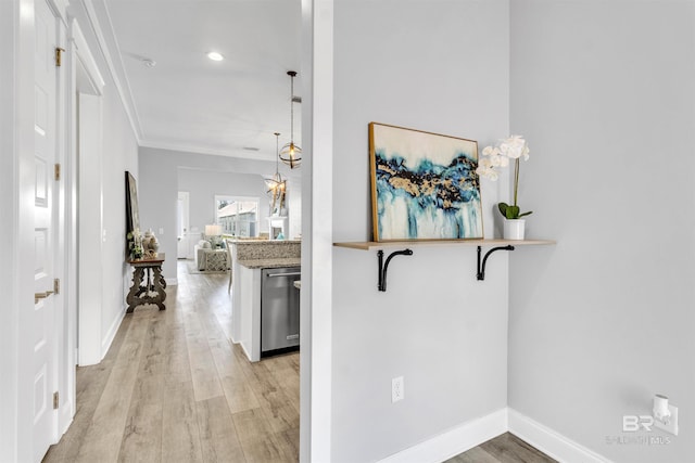 23901 Cypress Xing, Orange Beach, AL 36561 - hallway featuring baseboards, ornamental molding, and light wood finished floors