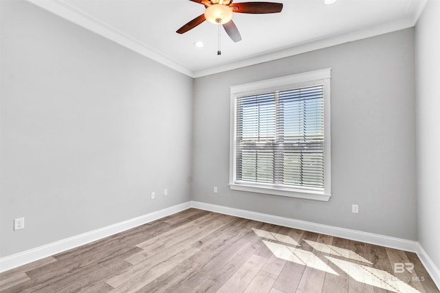 23901 Cypress Xing, Orange Beach, AL 36561 - spare room featuring baseboards, crown molding, wood finished floors, and a ceiling fan