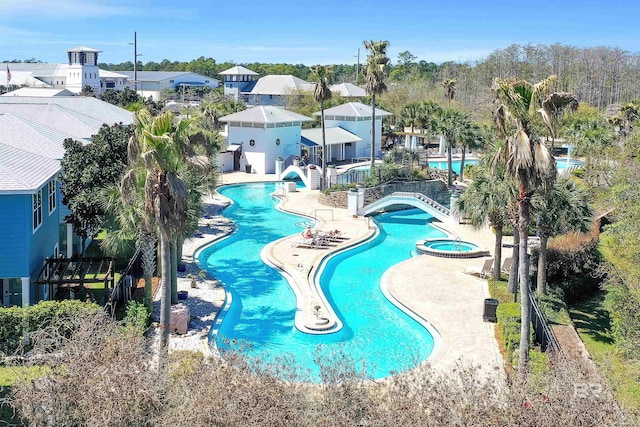 23901 Cypress Xing, Orange Beach, AL 36561 - pool featuring a hot tub, fence, a residential view, and a patio area