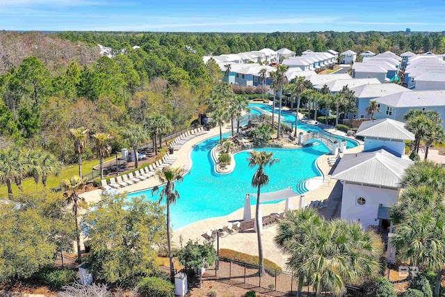 23901 Cypress Xing, Orange Beach, AL 36561 - community pool featuring a water slide and a wooded view