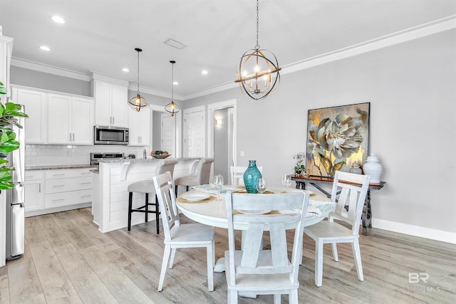 23901 Cypress Xing, Orange Beach, AL 36561 - dining room featuring light wood-type flooring, a notable chandelier, visible vents, and ornamental molding