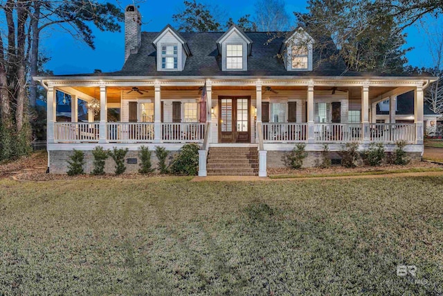 farmhouse-style home with a porch, a front yard, crawl space, and ceiling fan