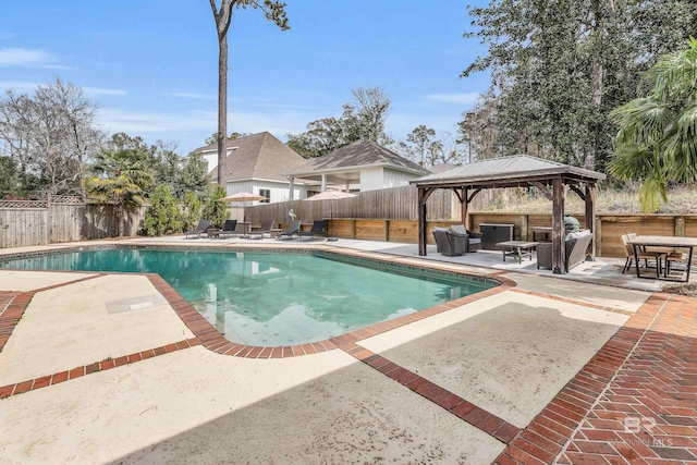 view of swimming pool with a fenced in pool, a fenced backyard, a patio, and a gazebo