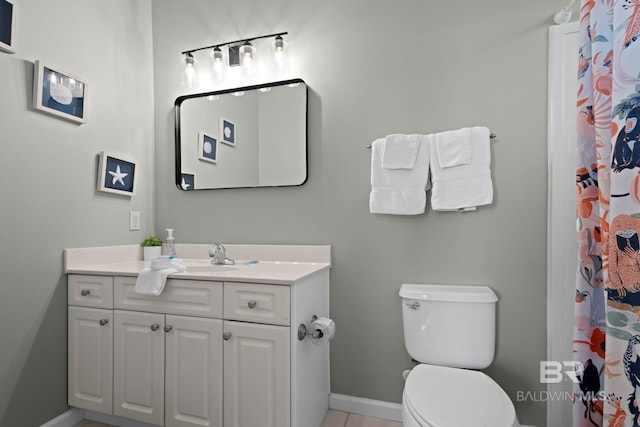 bathroom with vanity, a shower with shower curtain, and toilet