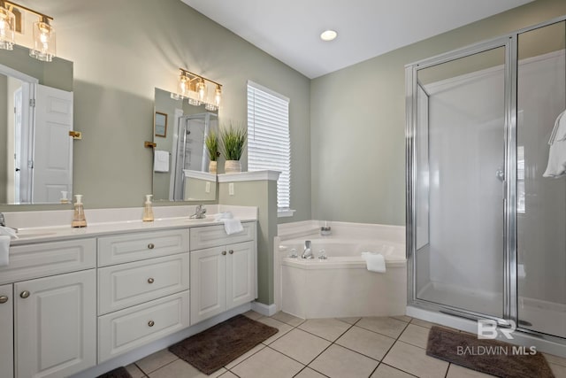 bathroom with tile patterned flooring, vanity, and separate shower and tub