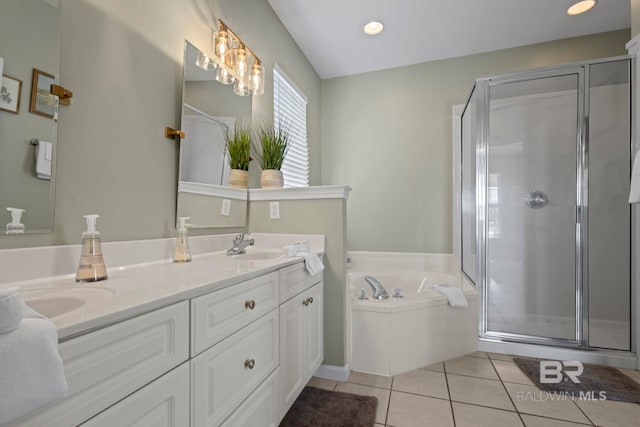 bathroom with plus walk in shower, tile patterned flooring, and vanity