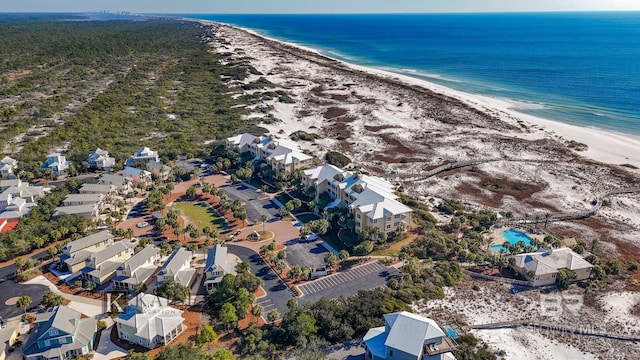 aerial view featuring a water view and a beach view