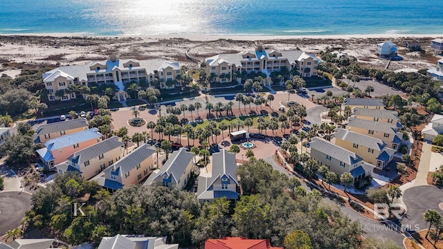 bird's eye view with a water view and a view of the beach