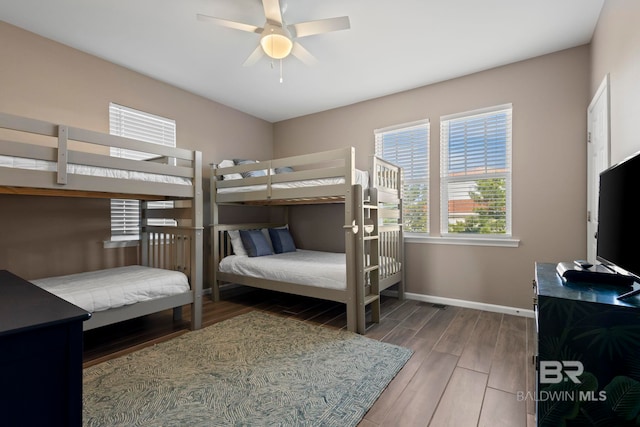 bedroom with hardwood / wood-style flooring and ceiling fan