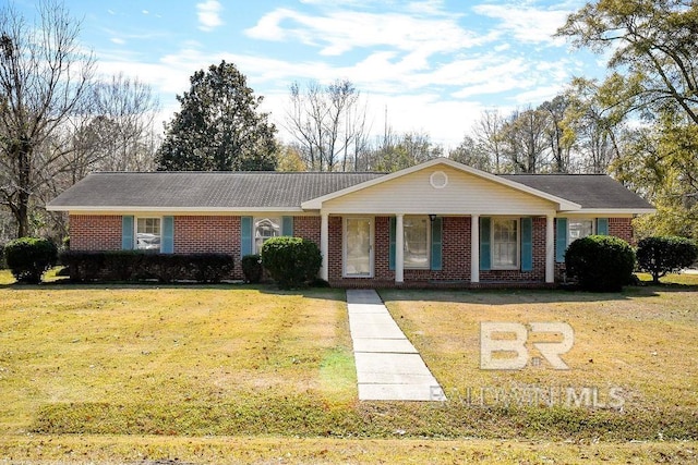 ranch-style house with covered porch and a front yard