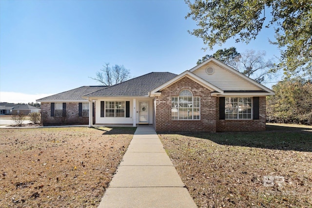 ranch-style home with a front yard