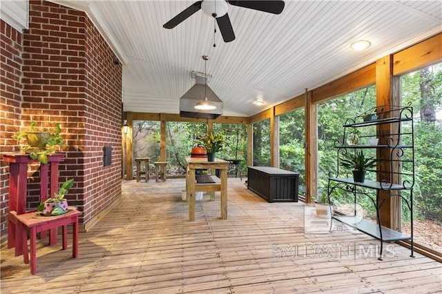 sunroom / solarium with ceiling fan