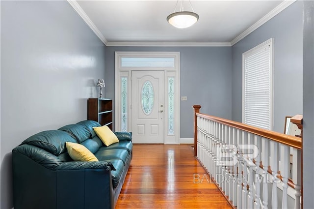 entrance foyer featuring hardwood / wood-style flooring and ornamental molding