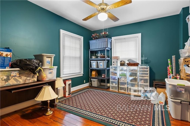 office space with ceiling fan and hardwood / wood-style floors