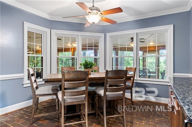 dining room with ornamental molding and ceiling fan